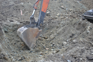 a bulldozer digging through dirt