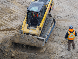construction worker operating a heavy machinery